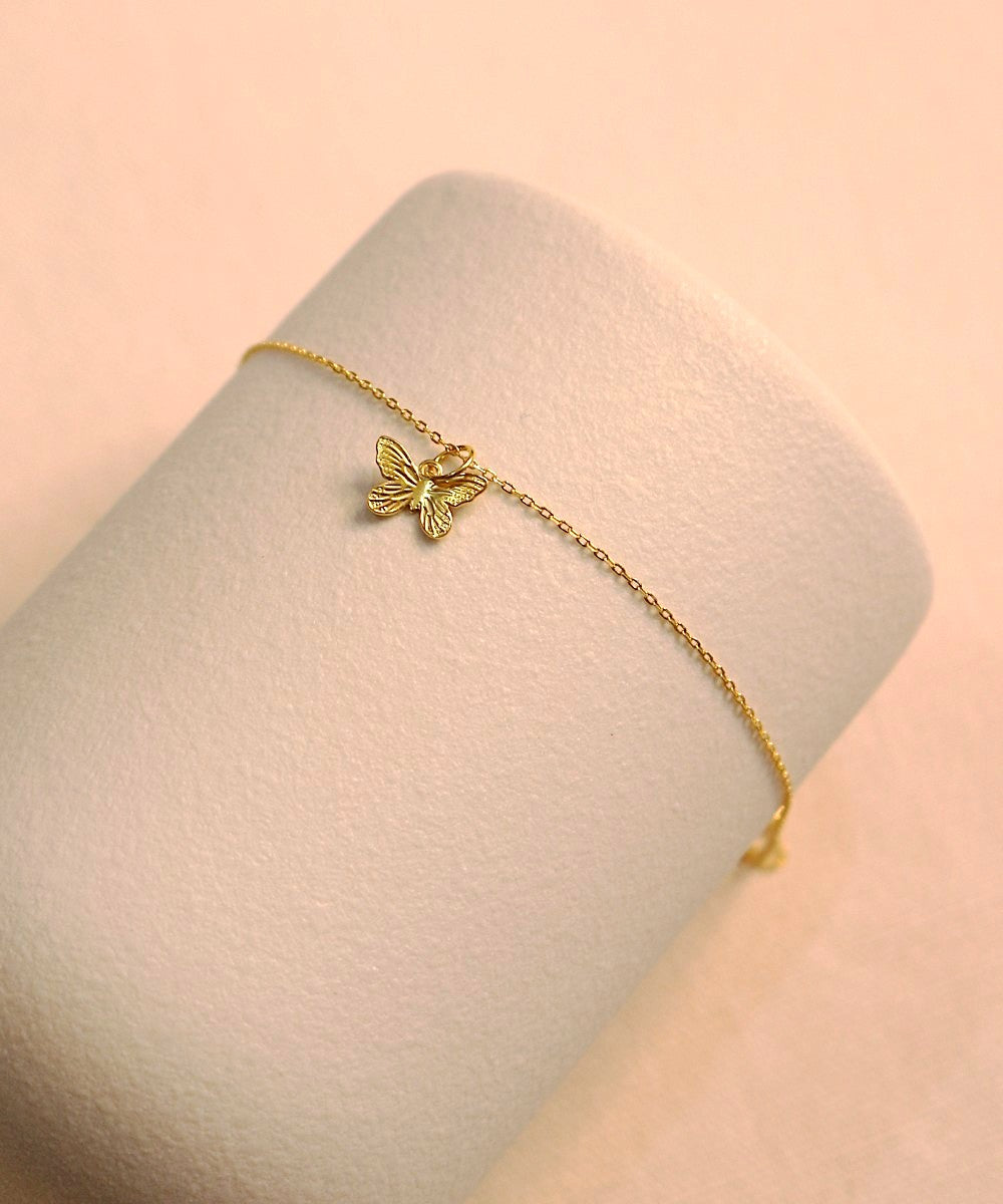 Whispers of Change – Butterfly Charm Bracelet
